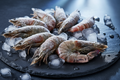 Frozen shrimp on ice, premium seafood for home kitchen