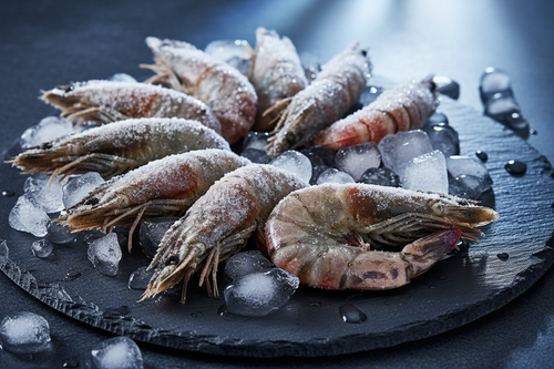 Frozen shrimp on ice, premium seafood for home kitchen