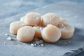 Fresh sea scallops on slate with sea salt, premium seafood for gourmet cooking