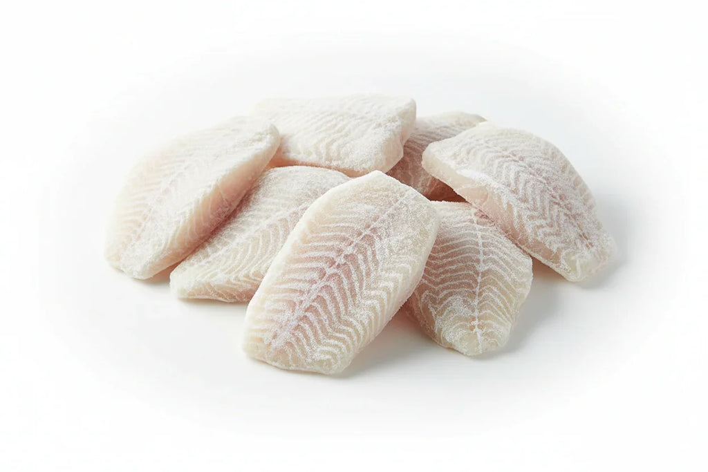 Frozen white fish fillets with visible texture, ideal for home cooking